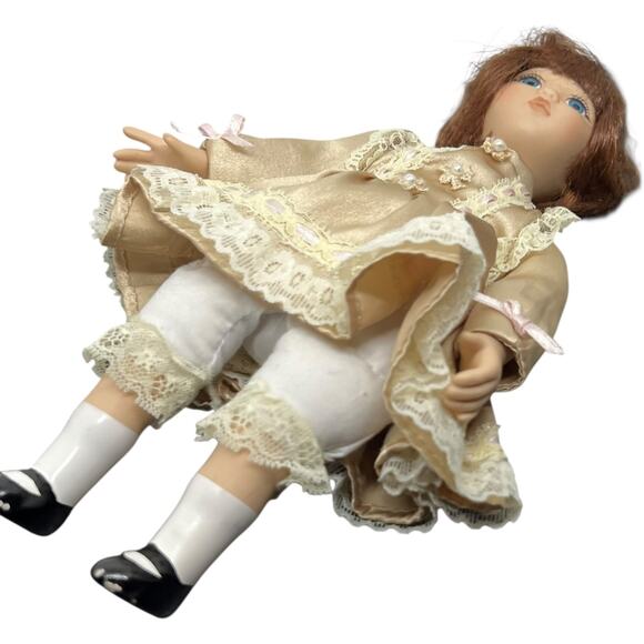 Porcelain Girl Doll in Champagne Satin Dress with Auburn Hair - Picture 3 of 11